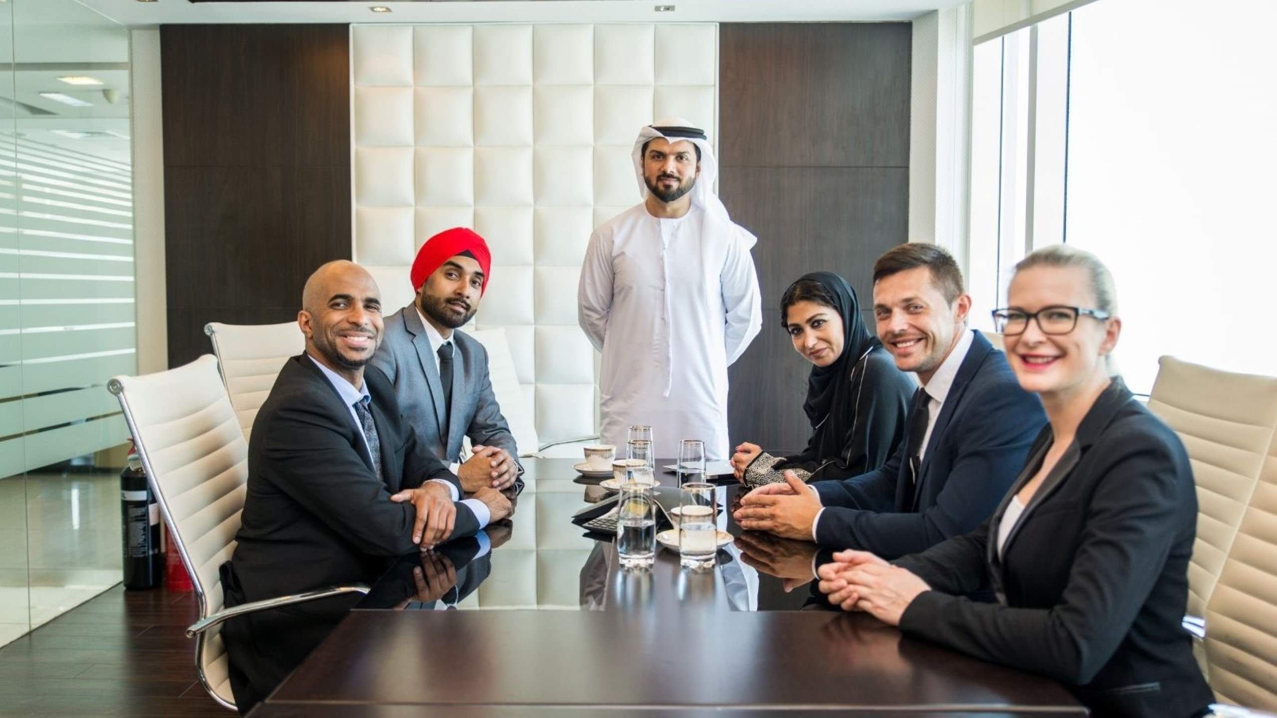 Diverse business team meeting in modern Dubai office startup ecosystem entrepreneurs funding innovation investment