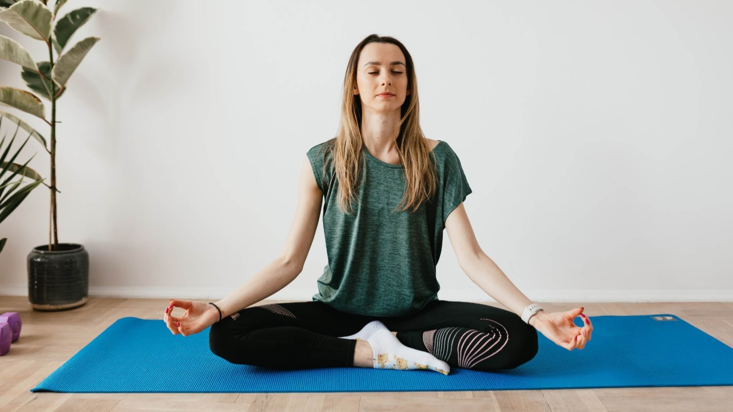 Woman doing yoga in wellness center mindfulness retreats meditation balance wellness luxury