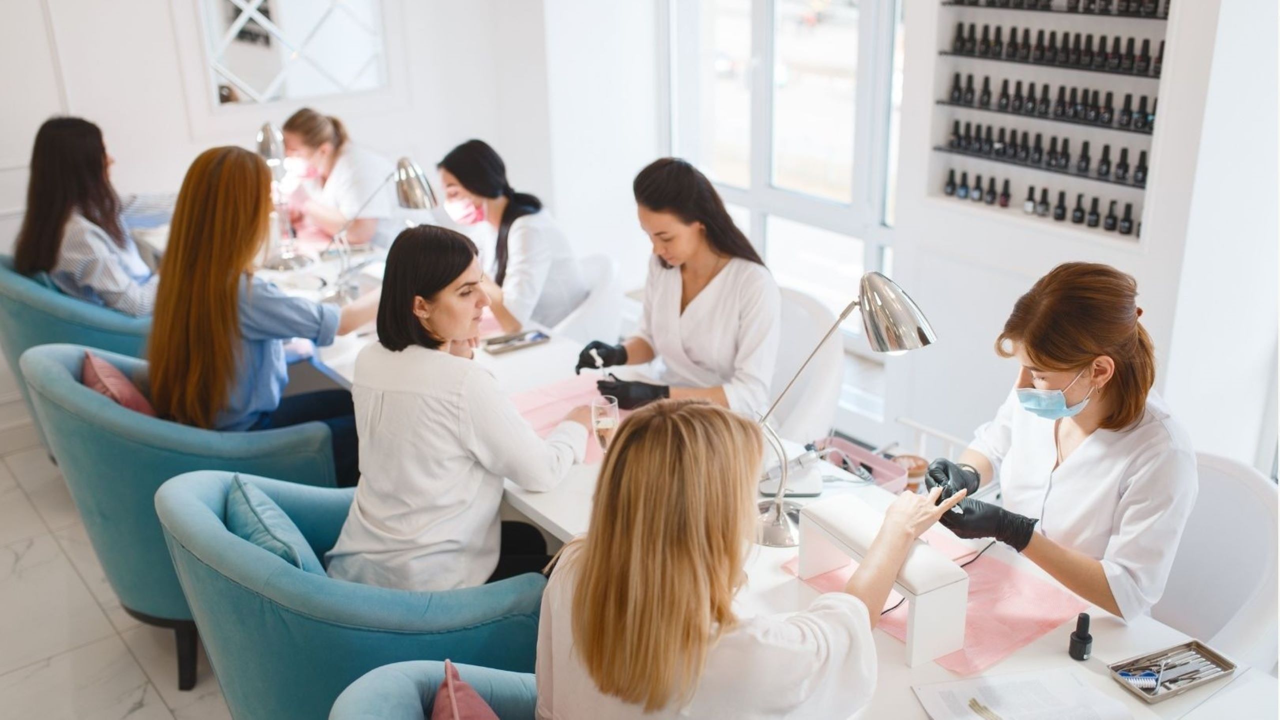 Young women students enjoying affordable manicure services at budget-friendly beauty spots in Dubai, showcasing accessible self-care options for university students and young professionals