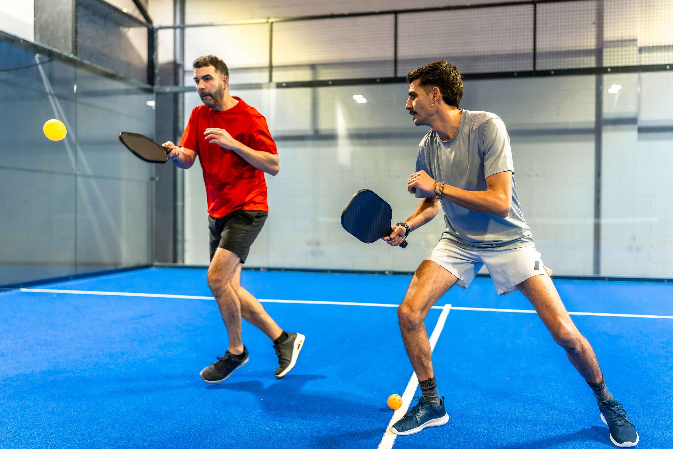 men playing padel at one of Dubais popular indoor sports venues during summer