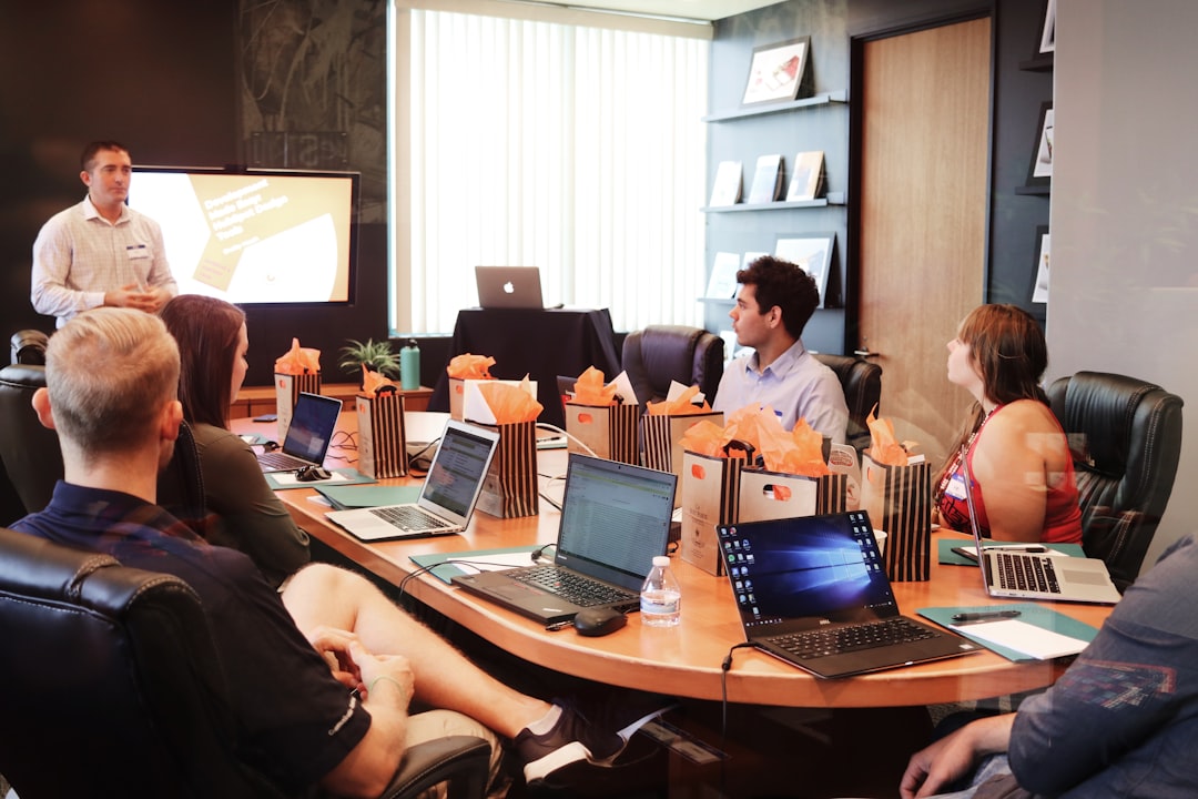 A business mentor and startup founder review a growth strategy together in a Dubai coworking space