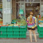 A group of people from different expat communities browsing a busy Dubai street market together