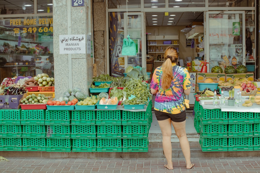 A group of people from different expat communities browsing a busy Dubai street market together