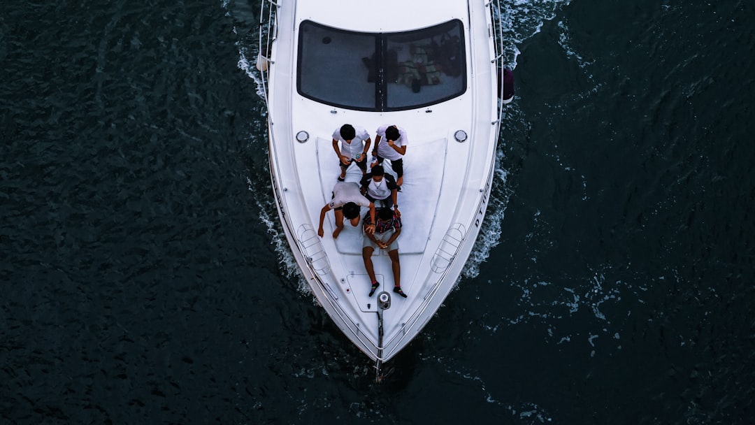 friends enjoying a private yacht charter in Dubai with the city skyline visible across the water
