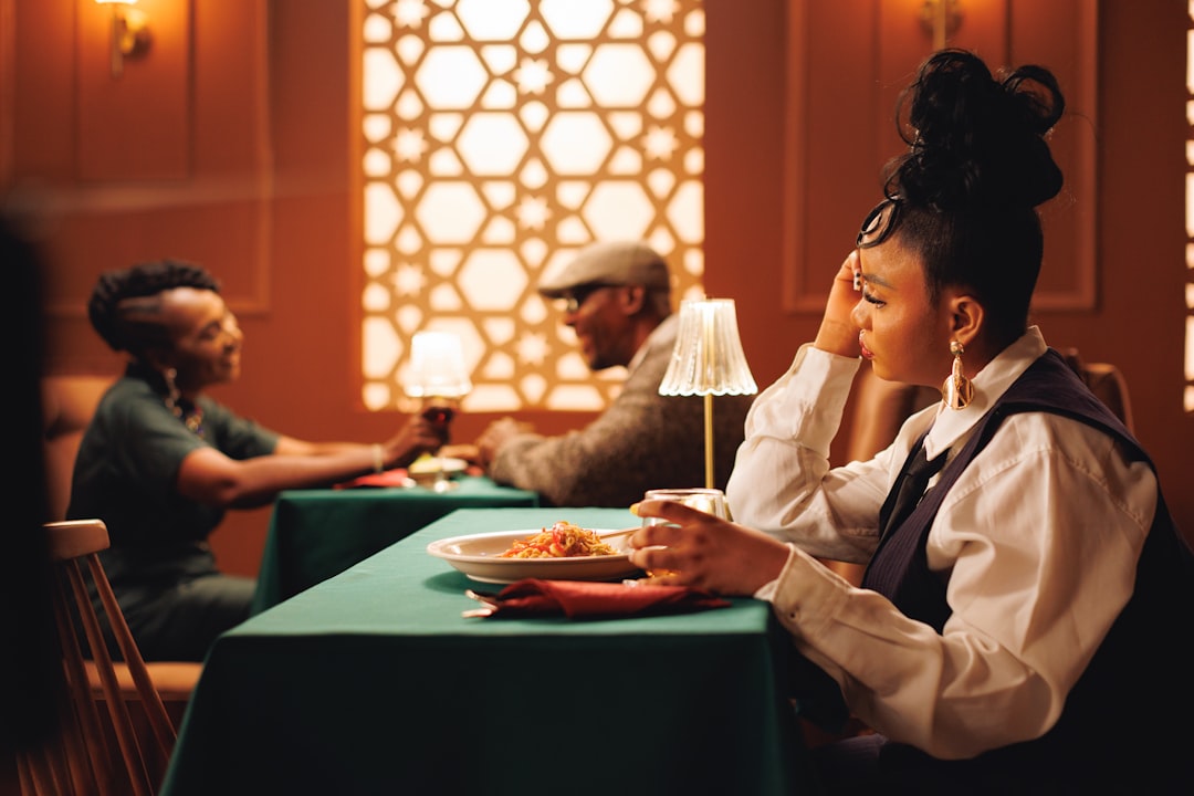 A woman enjoying a curated set menu during summer restaurant week at a Dubai restaurant