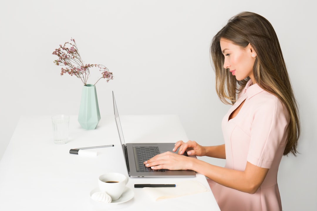 A female entrepreneur builds her personal brand strategy during Dubai's low season at a modern co-working space