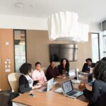 An African tech founder reviews expansion plans at a modern Dubai office, representing the growth of African tech companies.