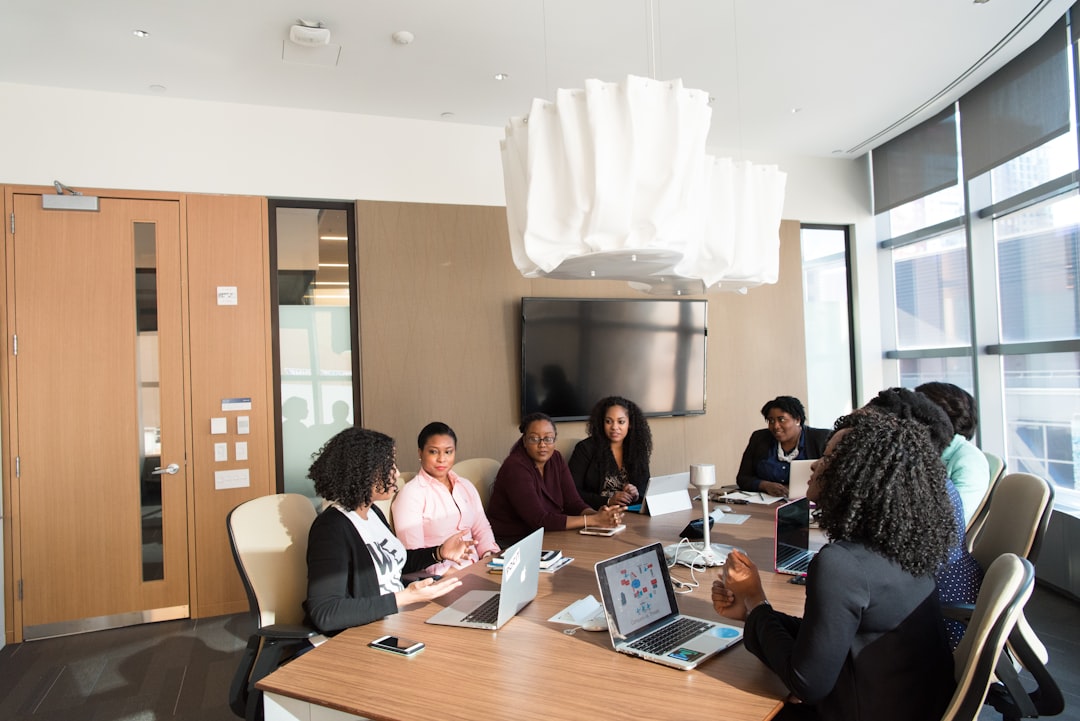 An African tech founder reviews expansion plans at a modern Dubai office, representing the growth of African tech companies.