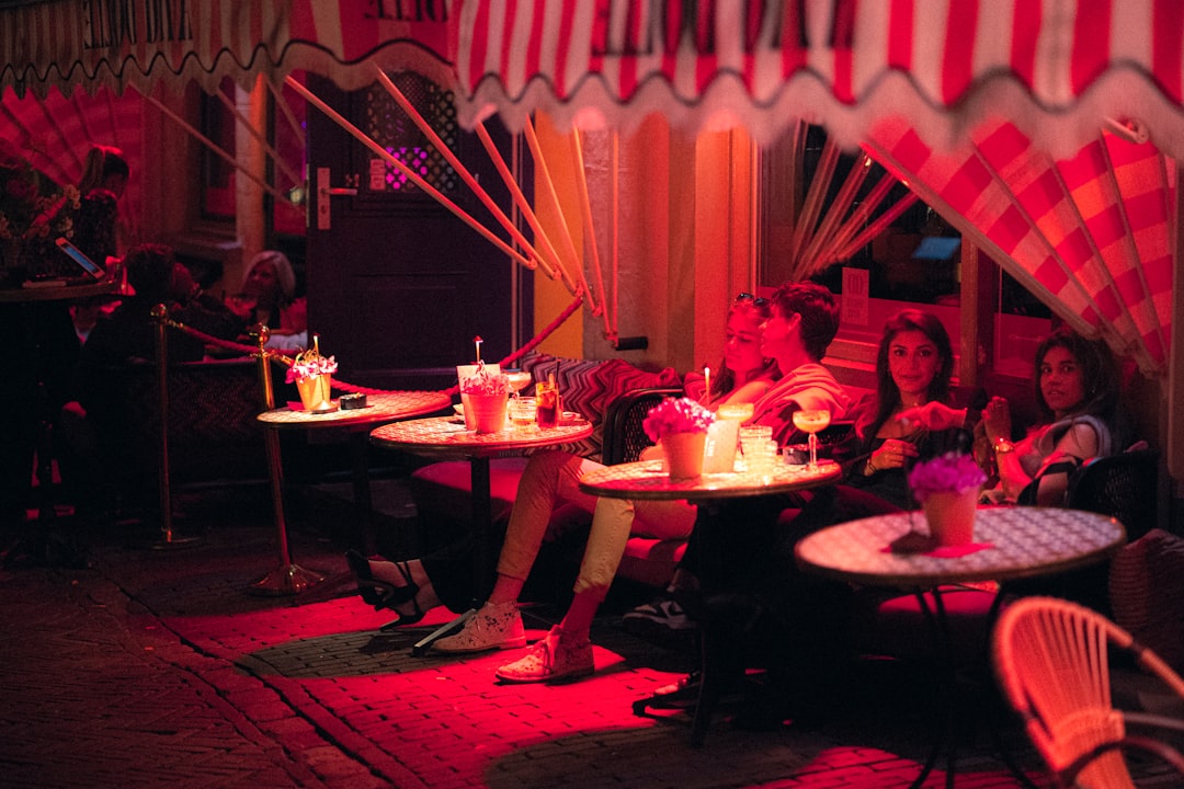 A couple enjoying terrace dining in Dubai at a candlelit outdoor table with soft evening light