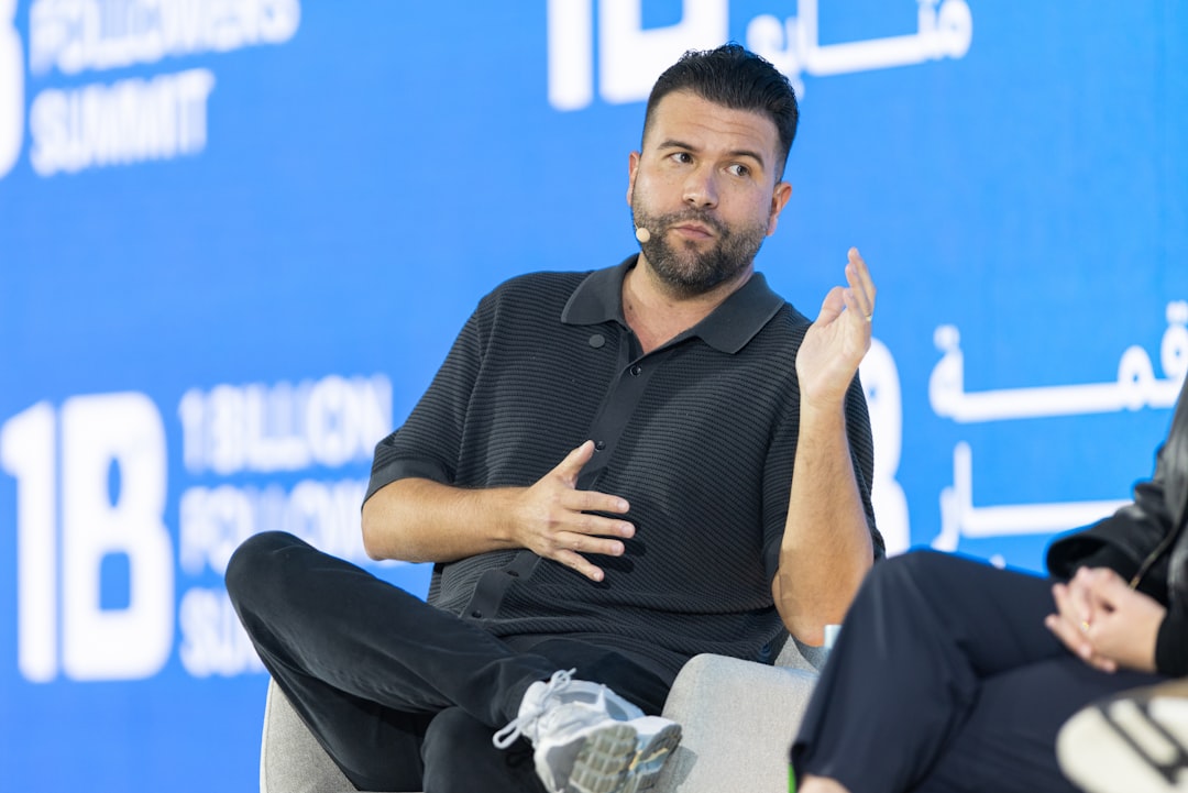 A startup founder presenting to investors inside a Dubai accelerator programme meeting room